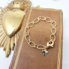 Bracelet torsadé plaqué or avec croix ou colombe