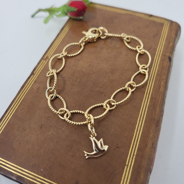 Bracelet torsadé plaqué or avec croix ou colombe