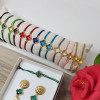 Bracelet cordon d'un croix trèfle de couleur sertie doré